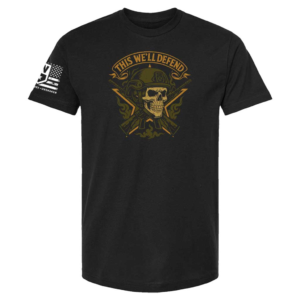 Black t-shirt with skull in helmet, crossed rifles, flames, and banner “This We’ll Defend”