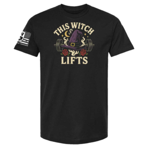 Black t-shirt with witch hat on barbell graphic, roses and moons around, text “This Witch Lifts”